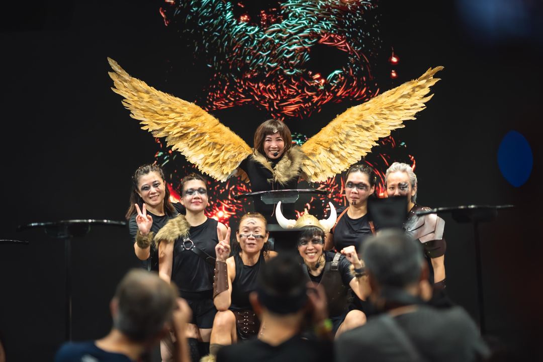 The crew in costume, golden wings and all