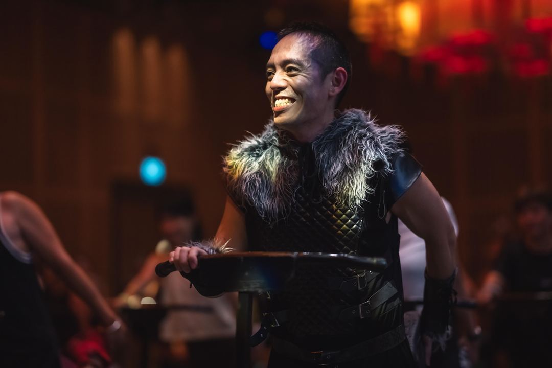 An instructor in costume, all smiles